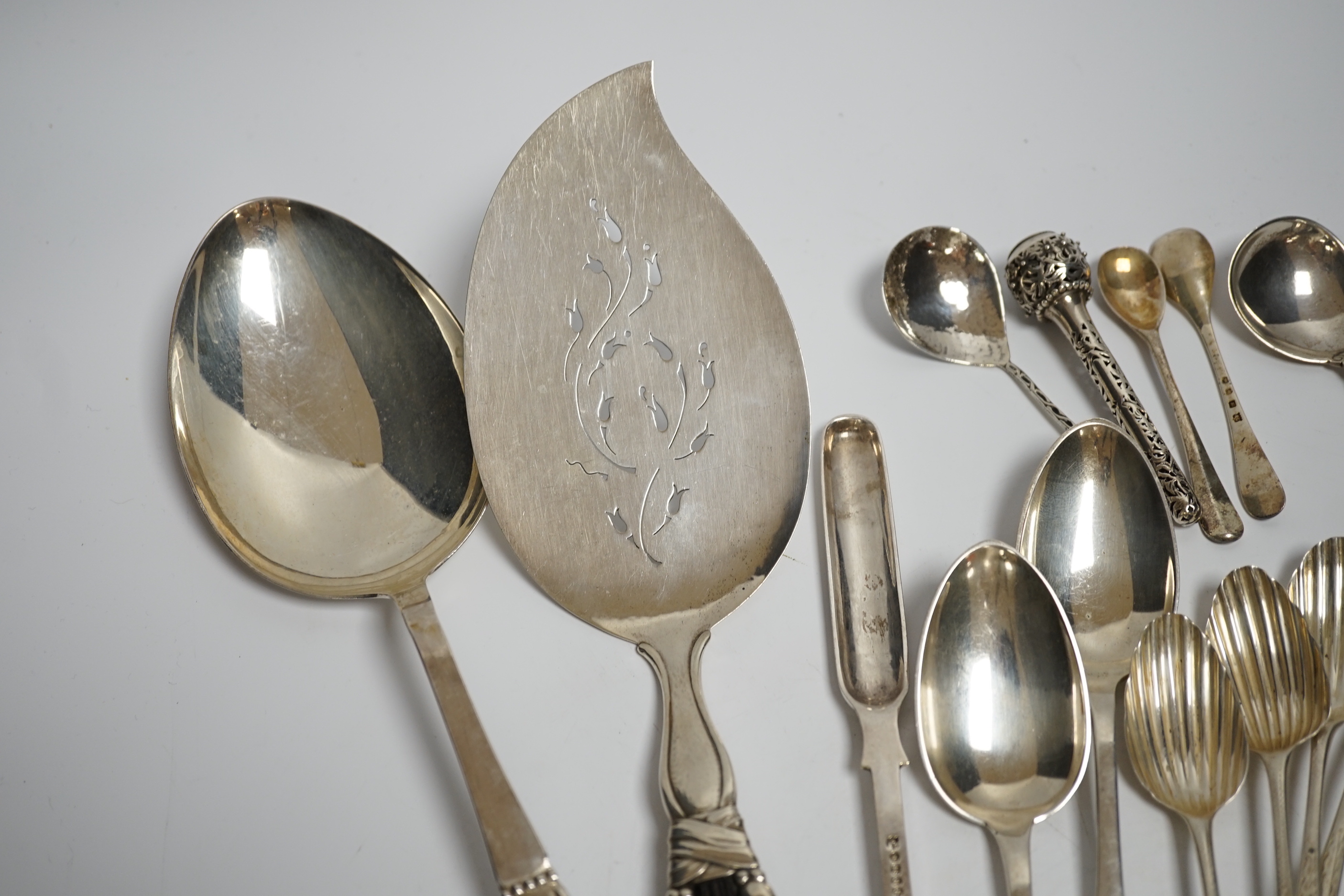 An early to mid 20th century Georg Jensen sterling and hardwood server, 26.1cm and a similar caddy spoon, together with other silver flatware, Scandinavian flatware and a plated marrow scoop.